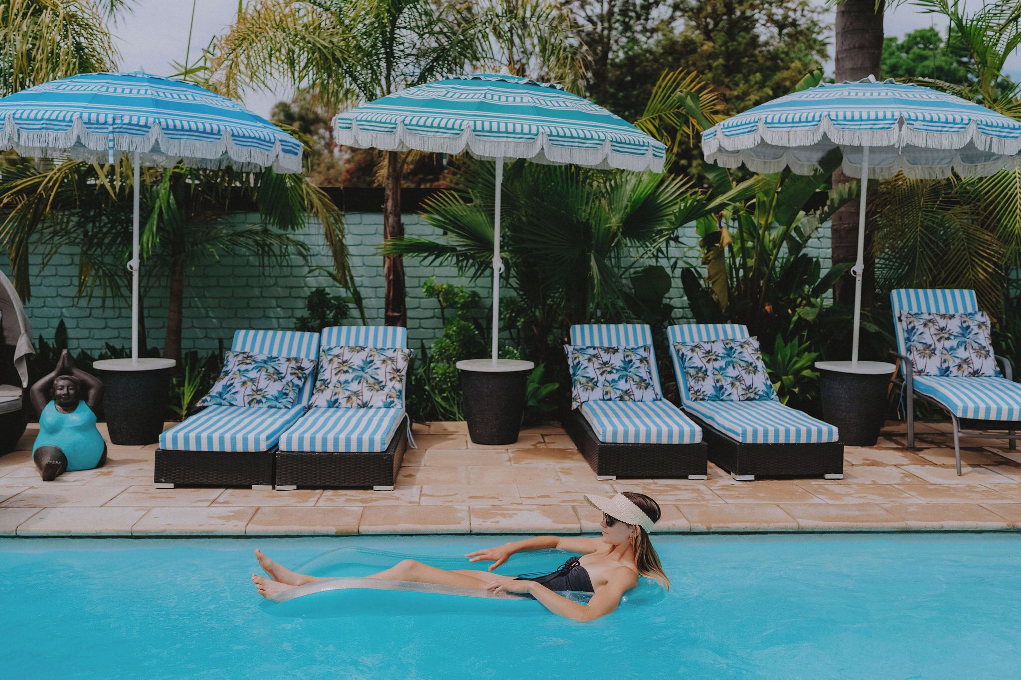 Seasonal outdoor pool, open 8:00 AM to 9:00 PM, pool umbrellas