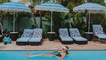 Seasonal outdoor pool, open 8:00 AM to 9:00 PM, pool umbrellas