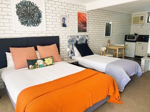 Deluxe Double or Twin Room, Multiple Beds, Kitchenette | Premium bedding, down comforters, pillowtop beds, individually decorated