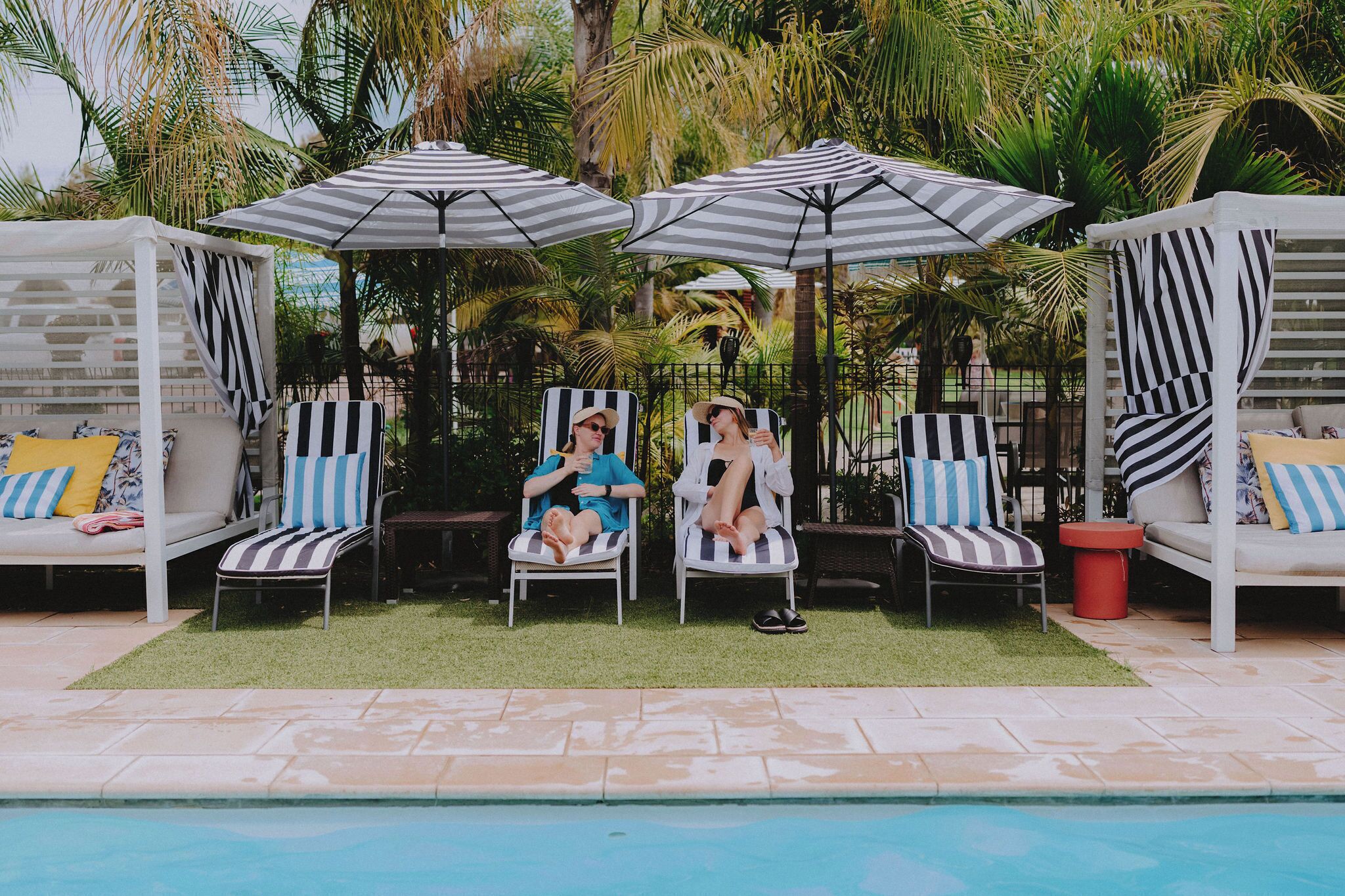 Seasonal outdoor pool, open 8:00 AM to 9:00 PM, pool umbrellas