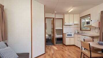 Deluxe-Suite, 2 Schlafzimmer | Wohnbereich | Flachbildfernseher