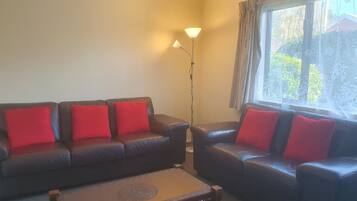 Deluxe Apartment, 2 Bedrooms | Living area | Flat-screen TV