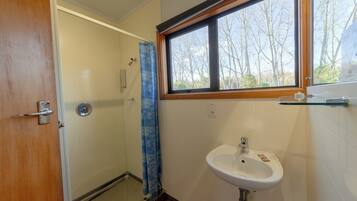 Upstairs Studio Unit with Balcony | Bathroom | Shower, eco-friendly toiletries, hair dryer, towels