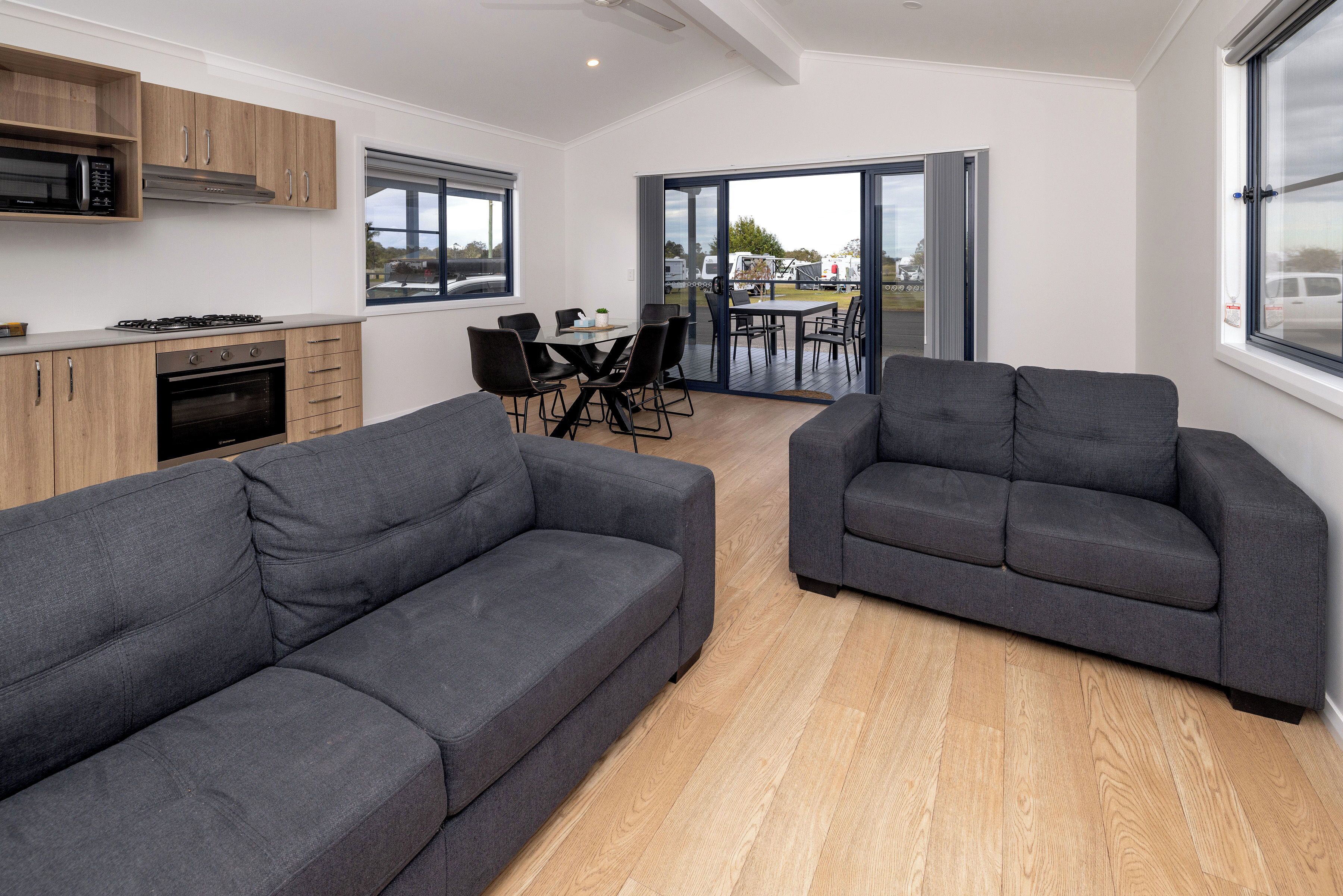 Deluxe 3 Bedroom Cabin | Living area | Flat-screen TV