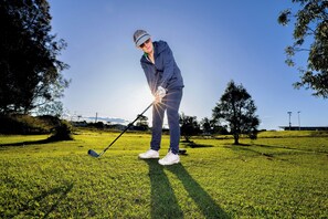 A person playing golf on a sunny day. - BIG4 Casino Holiday Park (Casino)