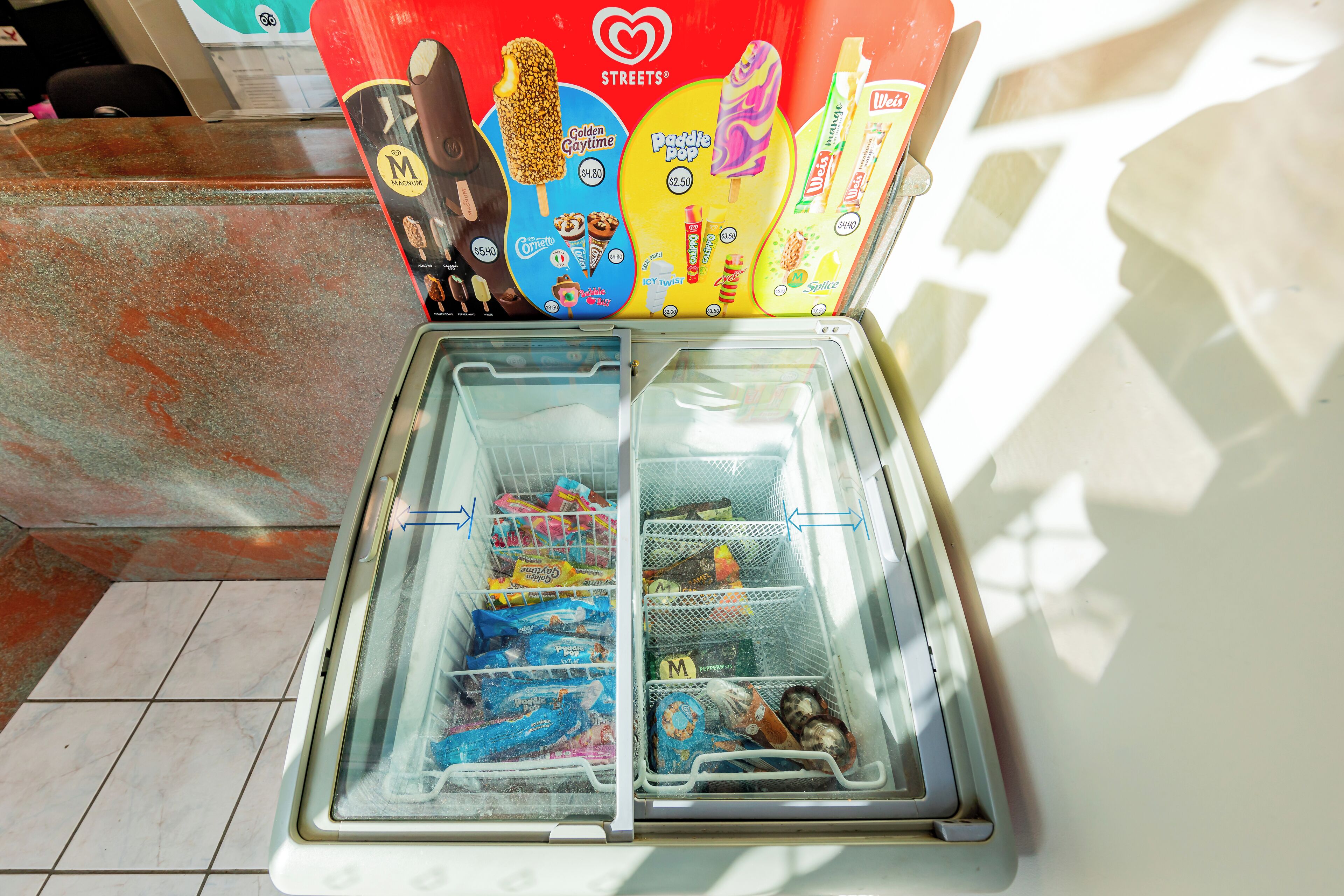A vending machine with various frozen treats and snacks.