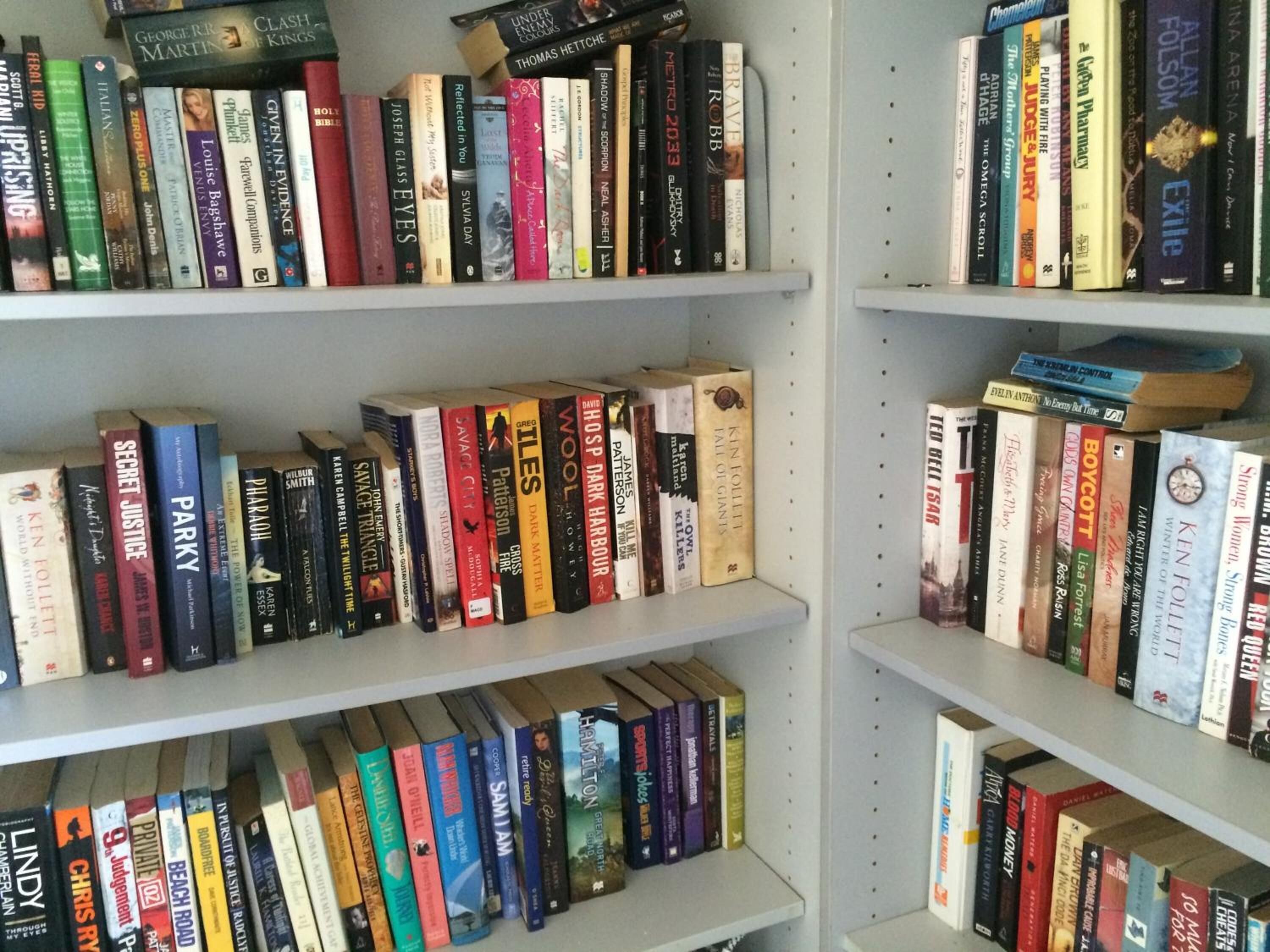 A bookshelf filled with various books.