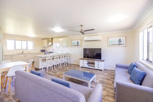 Superior Cabin | Living area | 32-inch TV with cable channels