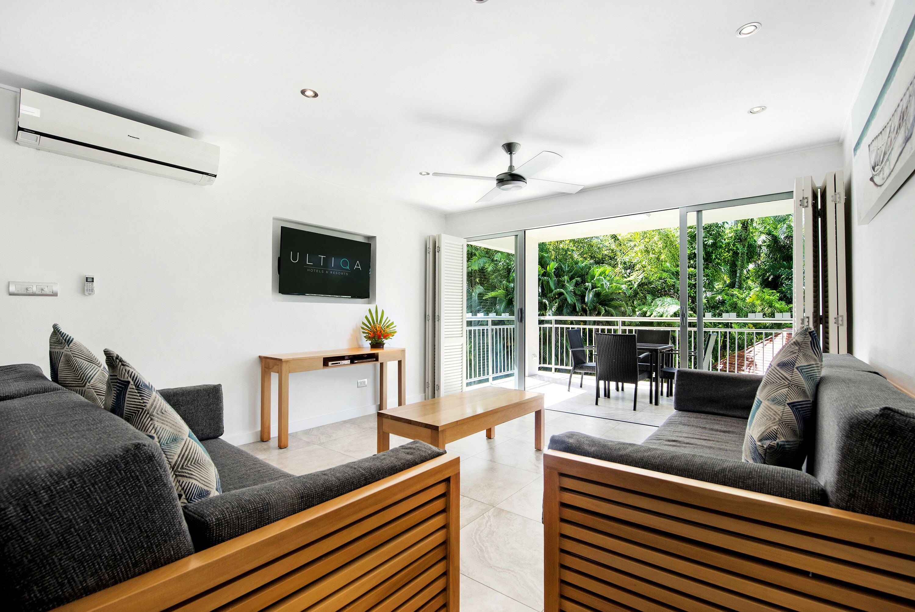 two bedroom deluxe apartment | living area | 47-inch tv with cable channels, dvd player