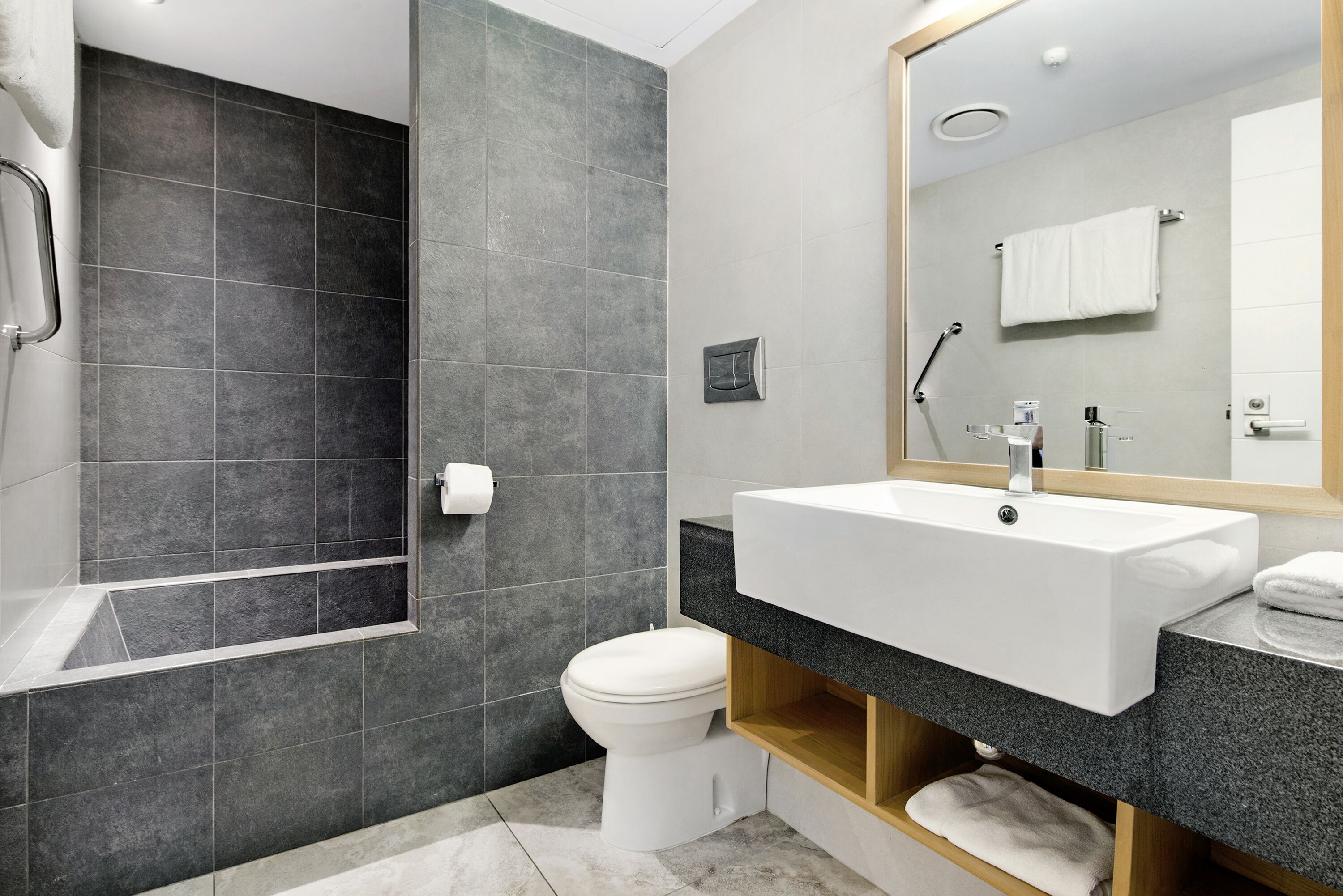 two bedroom deluxe apartment | bathroom | separate bathtub and shower, rainfall showerhead, free toiletries