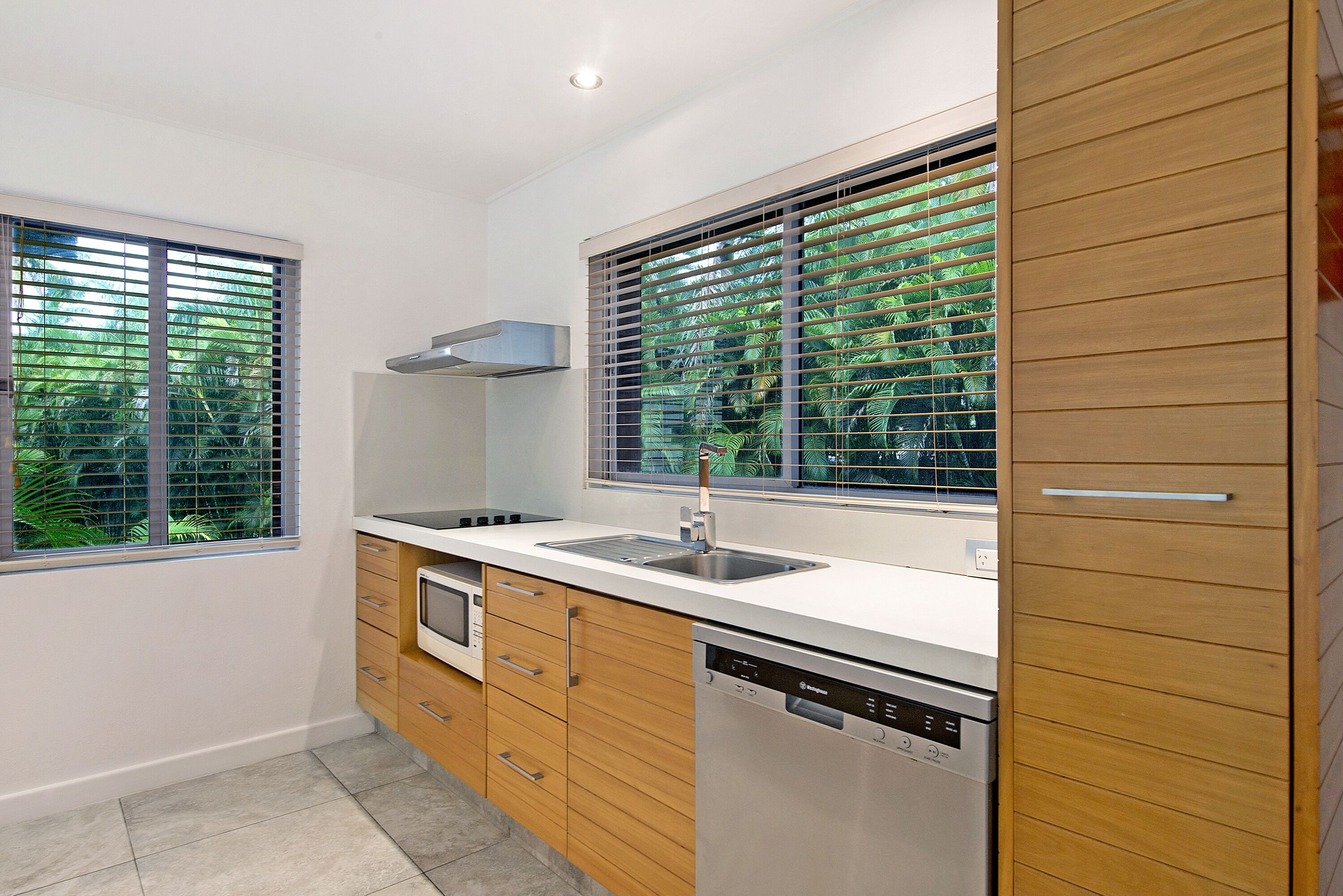 two bedroom deluxe apartment | private kitchen | full-sized fridge, microwave, stovetop, dishwasher