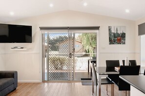 Deluxe Villa, 2 Bedrooms | Living area | LCD TV, DVD player - Port Fairy Holiday Park (Port Fairy)