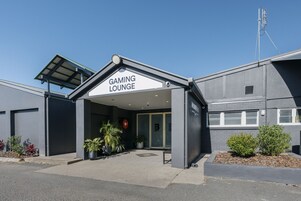 A building with a sign reading "GAMING LOUNGE" at the entrance.