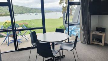 Standard Suite, 1 Bedroom, Non Smoking, Kitchen (on Waterfront) | Living area