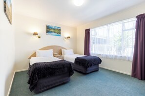 Family One Bedroom with Spa Bath | Pillowtop beds, blackout drapes, soundproofing, iron/ironing board