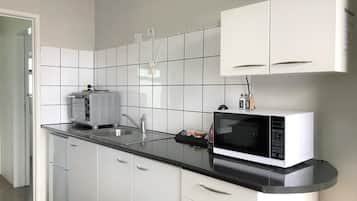 Deluxe Room, 1 Bedroom | Private kitchen | Fridge, microwave, stovetop, coffee/tea maker