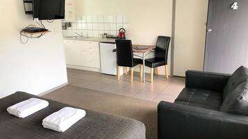 Superior King Studio | Living area | Flat-screen TV