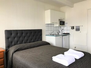Compact Double Bed Only Studio | Living area | Flat-screen TV - Central Court Motel (Whangarei)