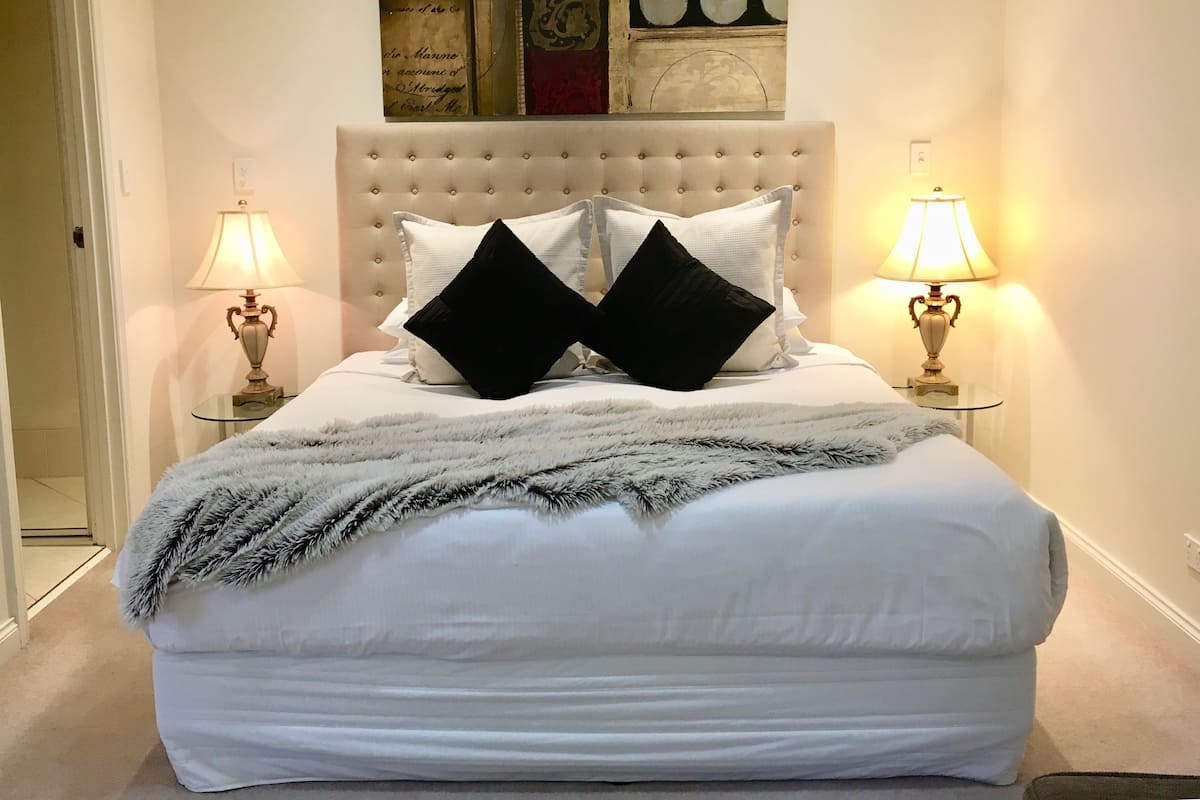 Jacaranda 1 Bedroom Suite | Egyptian cotton sheets, premium bedding, blackout drapes