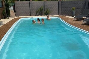Outdoor pool, open 8:00 AM to 8:00 PM, pool umbrellas, pool loungers