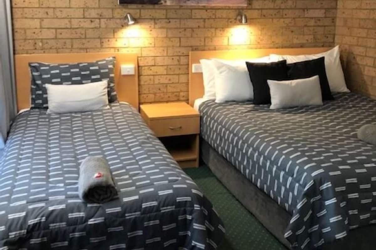 Quarto triplo família, para não fumantes | Frigobar, cortinas blackout, ferros/tábuas de passar roupa