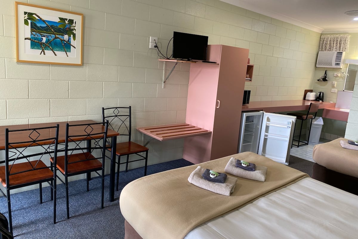 Premium bedding, pillow-top beds, laptop workspace, soundproofing
