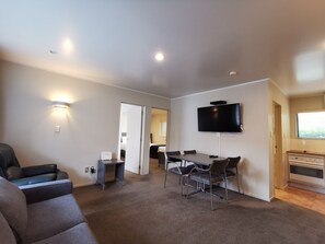 Two Bedroom Apartment - with Shower | Living area | 50-inch Smart TV with digital channels, TV, Netflix