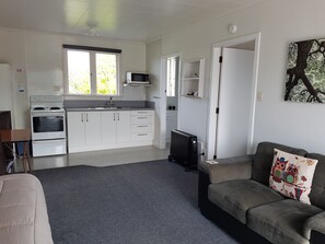 One Bedroom Unit 5 | Living room | Flat-screen TV