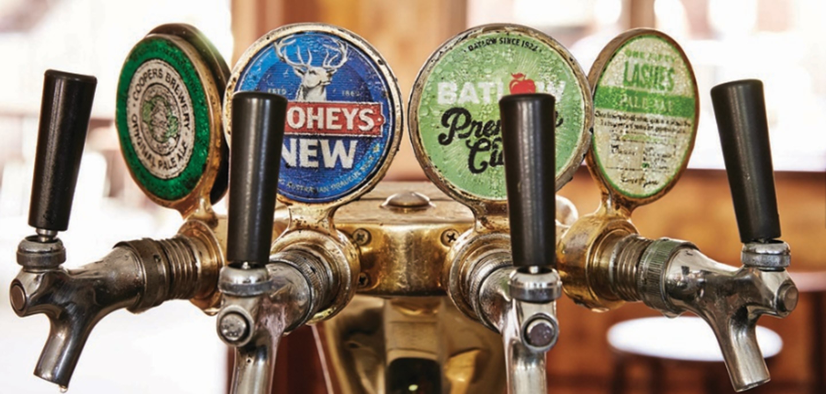 A tap with four spouts, each with a different label.