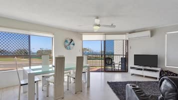 Three Bedroom | Living area | 42-inch flat-screen TV with digital channels, TV, Netflix