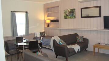 Standard Suite, 1 Bedroom, Non Smoking, Kitchenette (Unit 5 Spa) | Living area | TV, DVD player