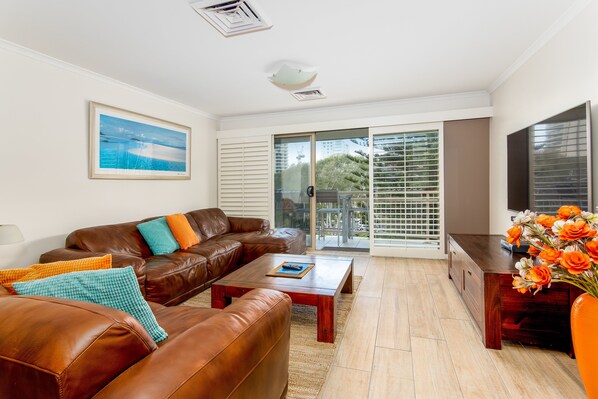 Executive Apartment, 2 Bedrooms, Kitchen | Living area | 50-inch flat-screen TV with digital channels, TV - The Village Holiday Apartments at Burleigh (Burleigh Heads)