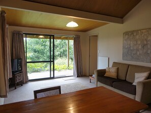 Standard Suite, 1 Bedroom, Non Smoking, Kitchenette (Cottage) | Living room | Flat-screen TV - Wharepuke Subtropical Accommodation (Kerikeri)