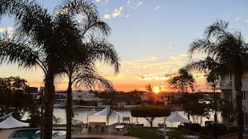 2 outdoor pools, open 7:00 AM to 9:00 PM, pool umbrellas, pool loungers