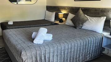 Individually decorated, desk, iron/ironing board, bed sheets