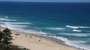 A beach with tents and people. - Narrowneck Court (Surfers Paradise)