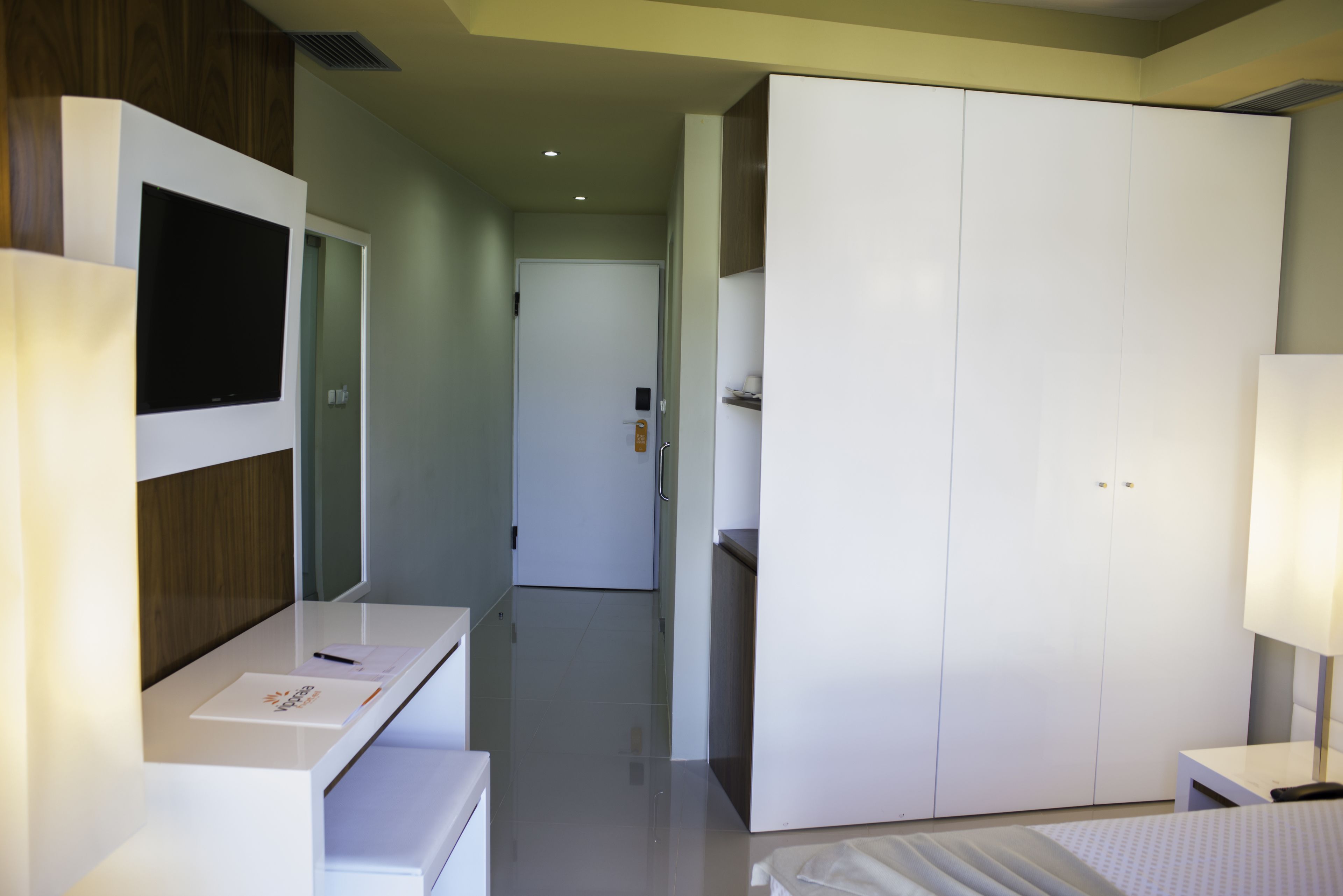 standard room, sea view | living room | flat-screen tv