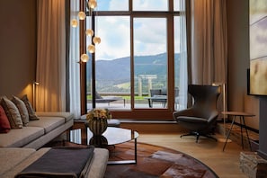 Maisonette Suite | Living area | Flat-screen TV, pay films