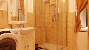 Apartment, 2 Bedrooms | Bathroom | Shower, free toiletries, hair dryer, towels