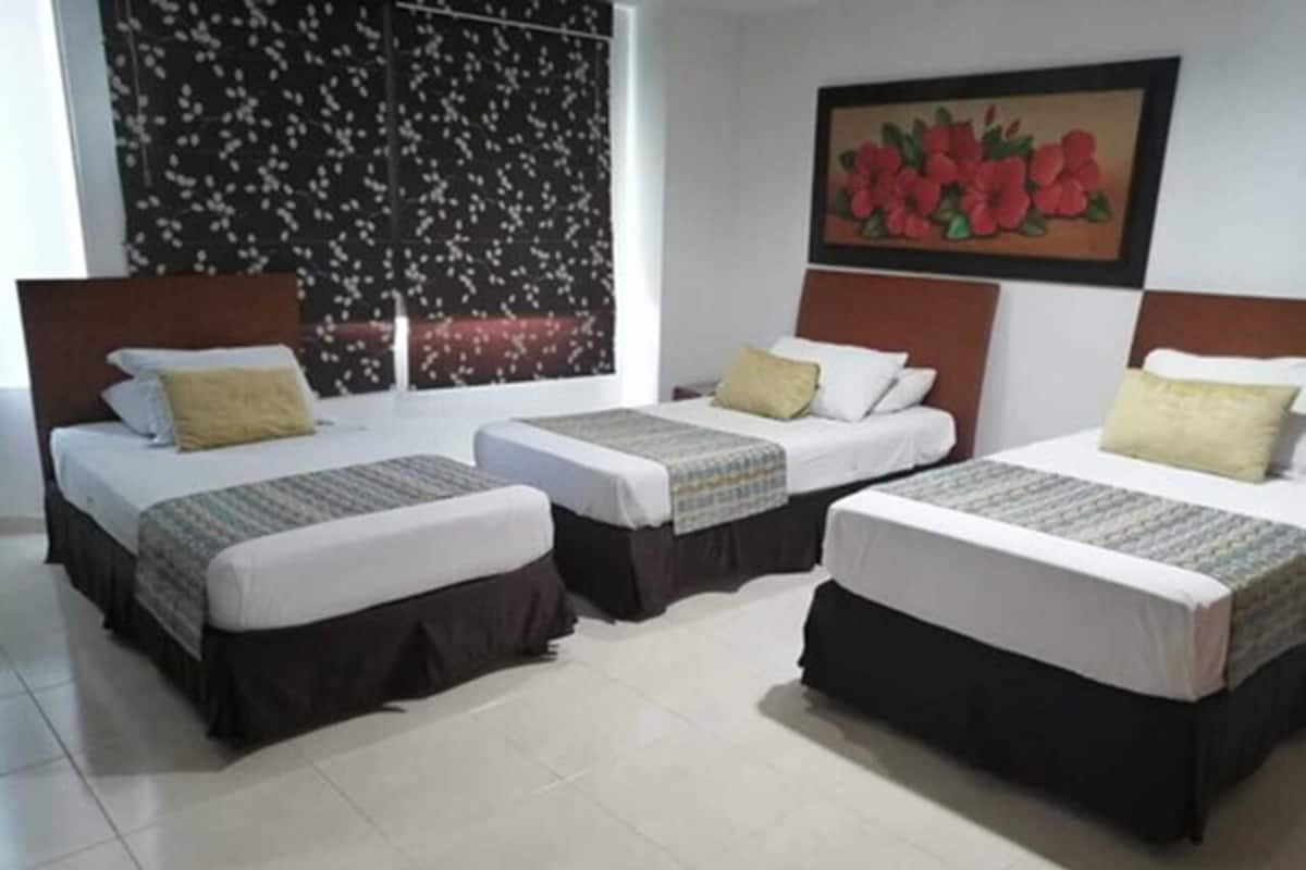 Family Triple Room | Minibar, in-room safe, desk, soundproofing