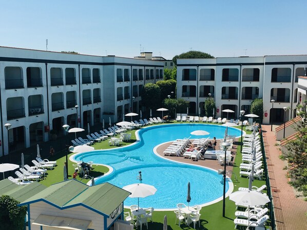 Seasonal outdoor pool, a rooftop pool, pool umbrellas, pool loungers