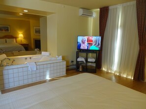 Superior Room, 1 King Bed, Jetted Tub, Hardwood Floor, Balcony, River View | Living area | 32-inch LCD TV with cable channels, TV - Hotel Alila  (Morin Heights)