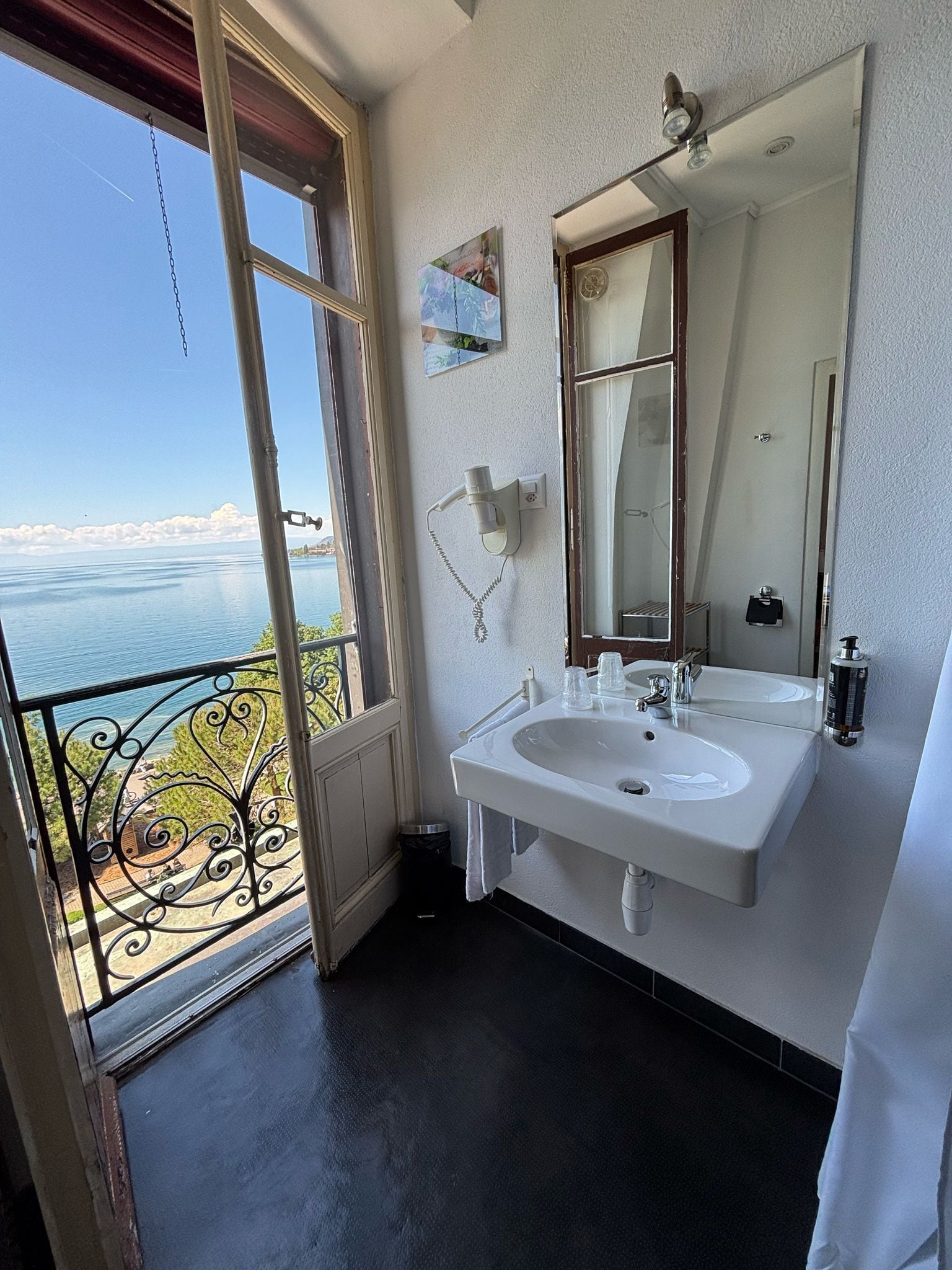 economy double room, 1 double bed, lake view | bathroom | hair dryer, towels, soap, shampoo