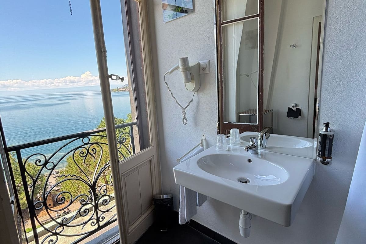 economy double room, 1 double bed, lake view | bathroom | hair dryer, towels, soap, shampoo
