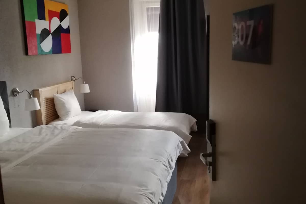 standard quadruple room, 1 bedroom, courtyard view | in-room safe, desk, iron/ironing board, free wifi