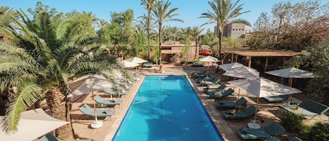 Outdoor pool, pool umbrellas, sun loungers