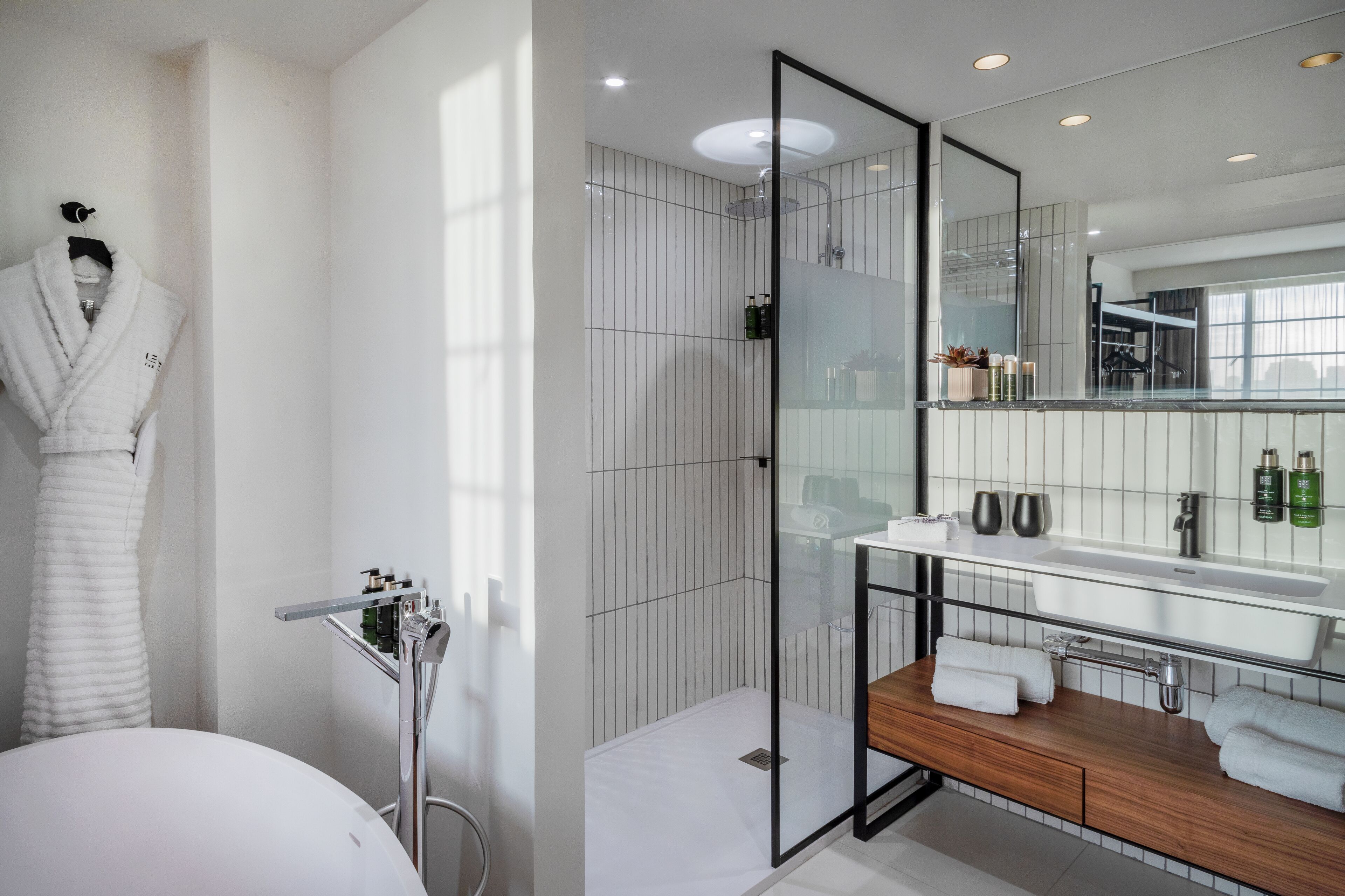 designer toiletries, hair dryer, bathrobes, slippers