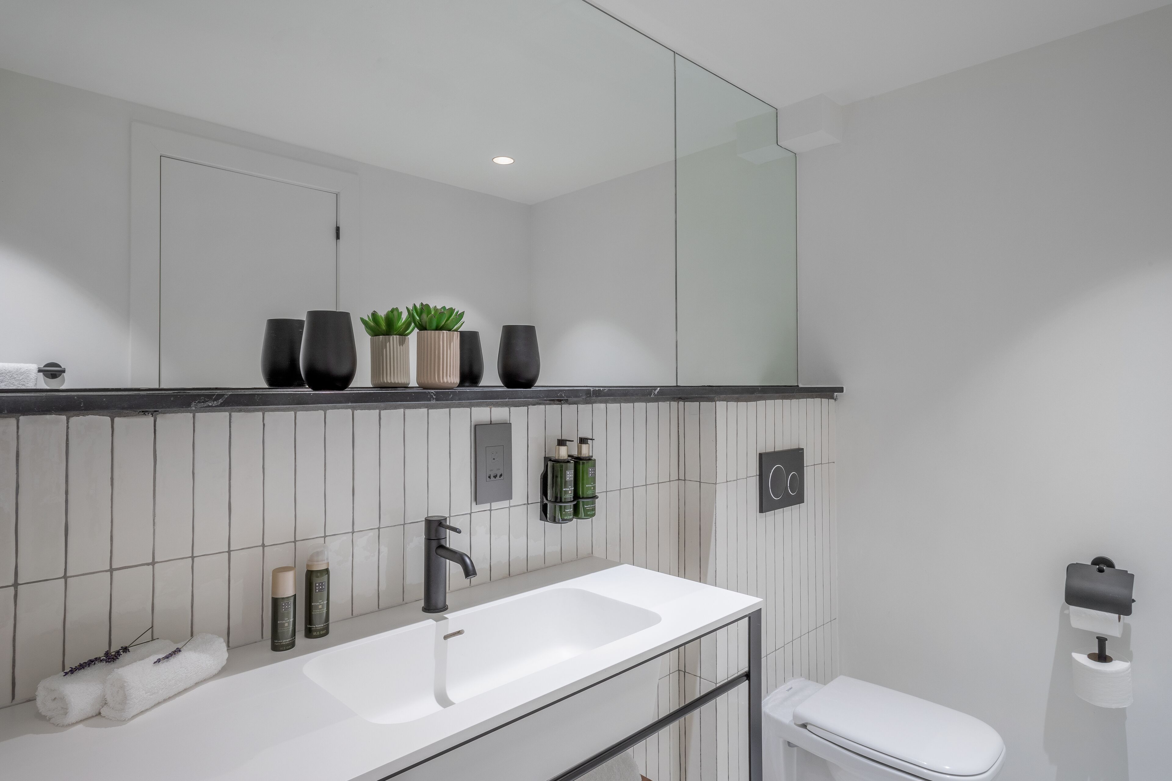Designer toiletries, hair dryer, bathrobes, slippers