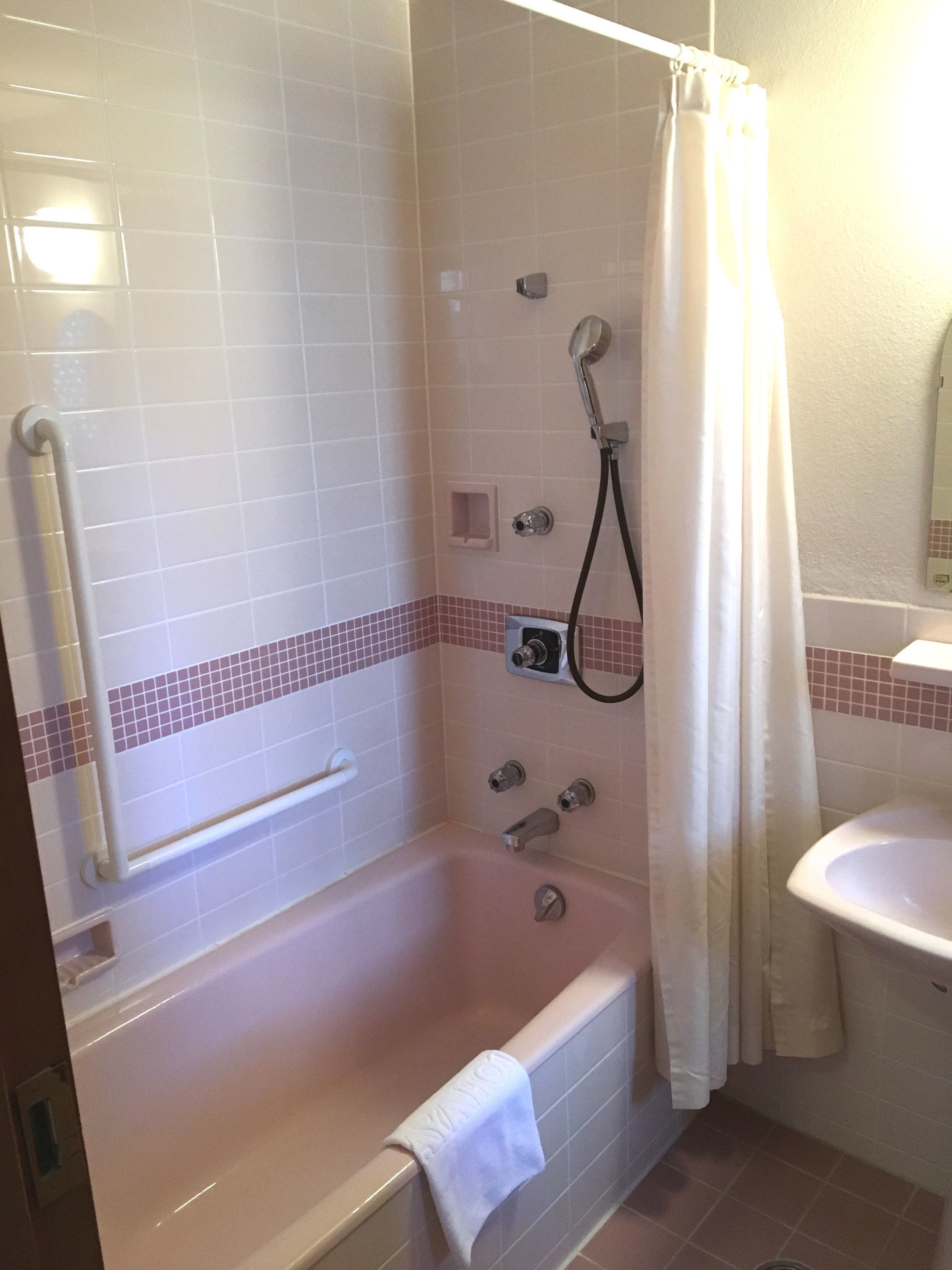 A bathroom with a walk-in shower, a bathtub, and a sink.