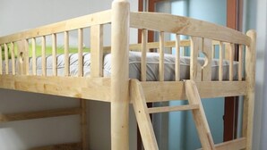 A bunk bed with a wooden ladder and a window. - Welcome Busan Guesthouse (Busan)